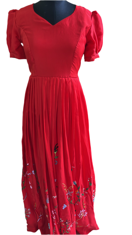 “Elegant Red Pleated Gown with Hand-Painted Floral Art”