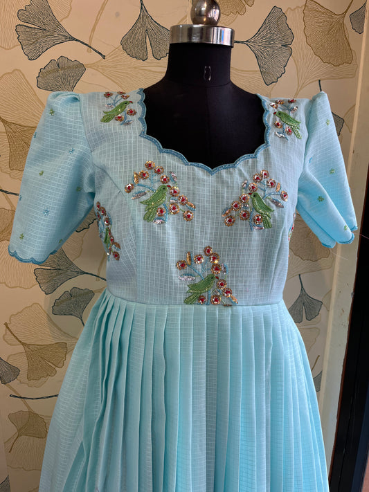 “Sky Blue Pleated Dress with Hand-Embroidered Floral Detailing”